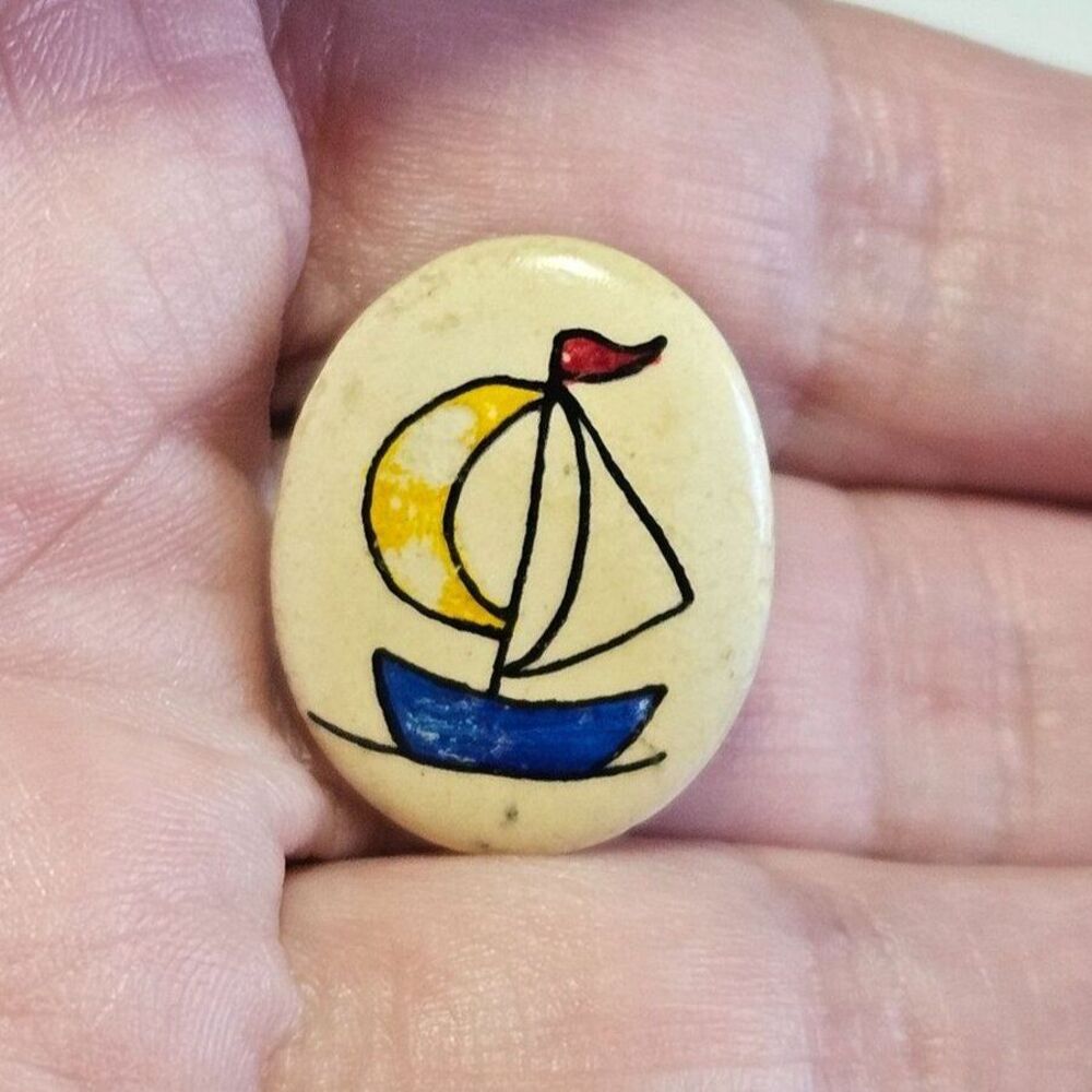 Stone sailboat pin